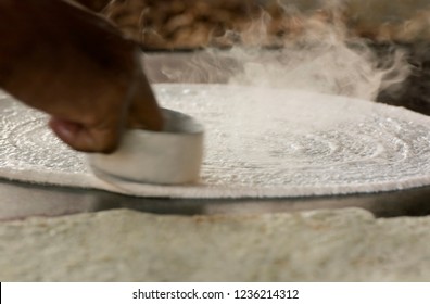 Dosa Batter Being Spread On Tawa
