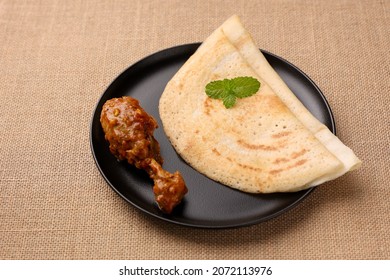 Dosa , Dosai, Ghee Roast With Chicken Curry Popular South Indian Breakfast Food, Kerala, Tamil Nadu India Sri Lanka. Masala Dosa With Non Vegetarian Indian Kadai Chicken Leg Curry.