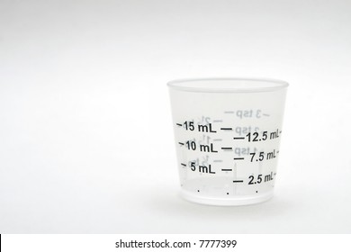 Dosage Cup With Metic Measurements Displayed