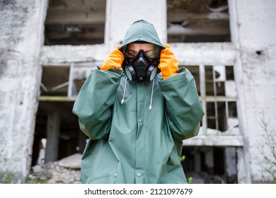 A Dosimetrist Scientist In Protective Clothing And A Gas Mask Checks The Level Of Radioactive Radiation In The Danger Zone. Environmental Pollution, Disaster