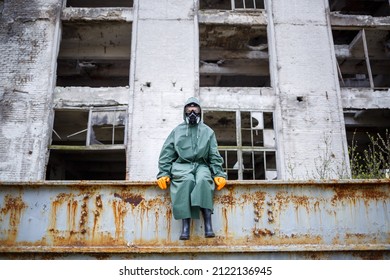 A Dosimetrist Scientist In Protective Clothing And A Gas Mask Checks The Level Of Radioactive Radiation In The Danger Zone. Environmental Pollution, Disaster