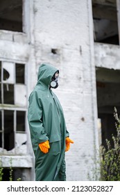 A Dosimetrist Scientist In Protective Clothing And A Gas Mask Checks The Level Of Radioactive Radiation In The Danger Zone. Environmental Pollution, Disaster