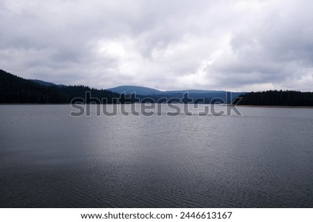 Dospat reservoir in the Rhodope mountains Bulgaria in cloudy weather.