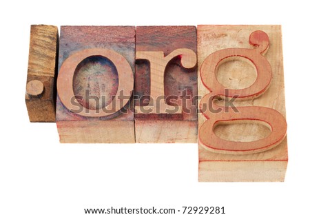 dot org - non-profit organization internet  domain extension in vintage wooden letterpress printing blocks, stained by color inks, isolated on white
