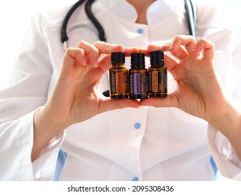 Doterra Brand Oil Holding Doctor Women. Belarus,minsk,2021. Therapeutic Grade Lavender, Frankincense, Wild Oranges Essential Oils For Good Sleep And Calming Down And Health