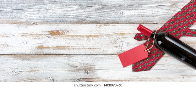 Dotted Necktie With Bottle Of Red Wine On White Rustic Wood For Fatherâ€™s Day Background