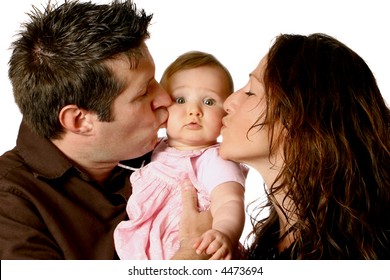 Dotting Mom And Dad Kissing Beautiful Baby Girl In Pink Dress.