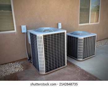 Double AC Units On Side Of Home With Dryscape On Driveway