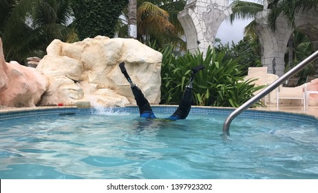 Double Amputee Doing Handstand In A Pool