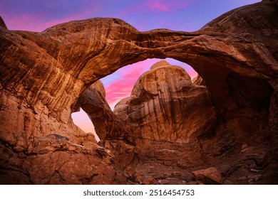 Double Arch, natural sandstone rock formation, at the Arches National Park in Moab, Grand County, Utah, USA: A sunrise landscape - Powered by Shutterstock