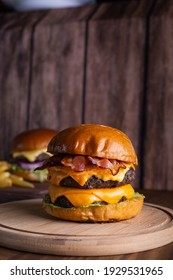 Double Bacon Cheeseburger In Wood Background