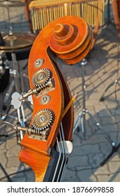 Double Bass Neck. Wooden And Metal Close-up Detail Of An Vintage Stringed Musical Instrument Double Bass, Cello, Viola, Violin