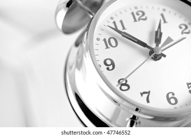 Double bell alarm clock isolated on a white background.