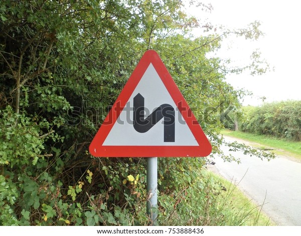Double bend to left road
sign