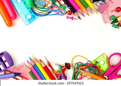 Double border of colorful school supplies on a white background