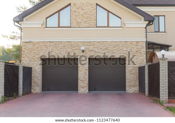
Double
brown shutters in the garage of a private
house