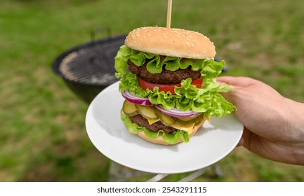 Double burger with beef meat with fresh vegetables, lettuce, tomato and onion - Powered by Shutterstock