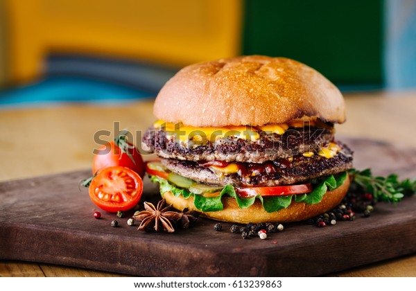 Double burger with beef, tomato, cheese and
lettuce and grilled
onions