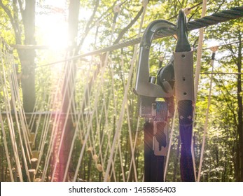 Double Carbine With Clutch In Sunlight On The Road Rope. Equipment For Climbing And Mountaineering. Safety Rope.