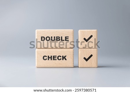 Double Check concept by stack wood blocks, verify information to prevent errors