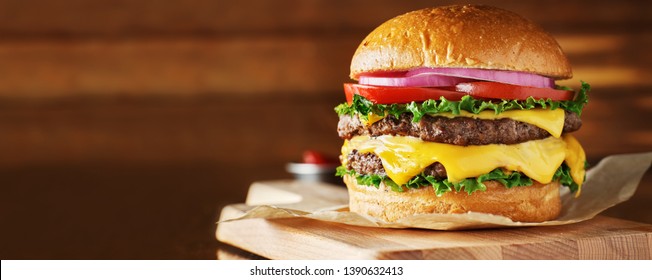 double cheeseburger with lettuce, tomato, onion, and melted american cheese with panoramic composition