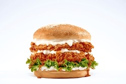 Double Chicken Burger With Ketchup, Cheese, And Mayonnaise On Isolated White Background.