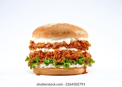 Double Chicken burger with ketchup, cheese, and mayonnaise on isolated white background.