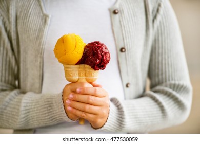 Double colorful ice cream in child's hand - Powered by Shutterstock