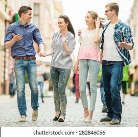 Double Couple Date. Friends Walking Down The Street Together.