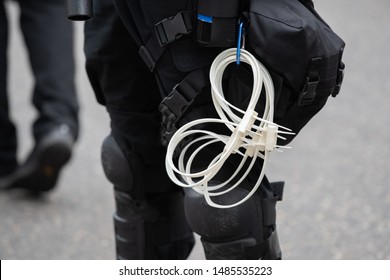 Double Cuff Zip Tie Plastic Handcuffs Hanging From A Police Belt