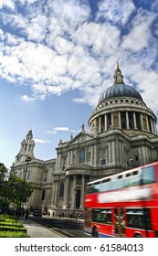  Double decker passing by front of St Paul's Cathedral. Summer sky for copy space.
