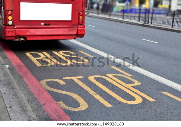 Double Decker\
red bus is running on road in\
London