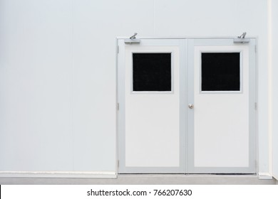 Double door in control room for pharmaceutical or food industry and concrete floor - Powered by Shutterstock