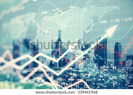 Double explosure with businesss charts and financial district of megapolis city