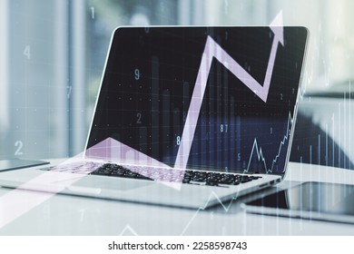 Double exposure of abstract creative financial chart with upward arrow on laptop background, research and strategy concept - Shutterstock ID 2258598743