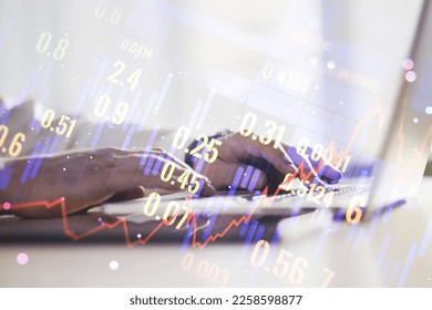 Double exposure of abstract creative financial chart with hand typing on computer keyboard on background, research and strategy concept - Shutterstock ID 2258598877