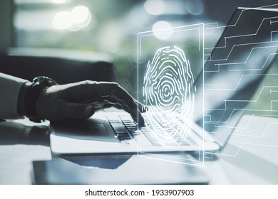 Double exposure of abstract creative fingerprint hologram with hands typing on laptop on background, research and development concept - Powered by Shutterstock