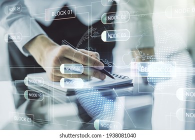 Double exposure of abstract creative programming illustration with world map and man hand writing in notepad on background, big data and blockchain concept