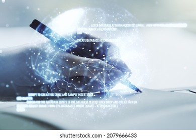 Double exposure of abstract creative programming illustration with world map and man hand writing in notepad on background, big data and blockchain concept