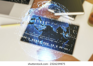 Double exposure of abstract creative programming illustration with world map and modern digital tablet on background, big data and blockchain concept