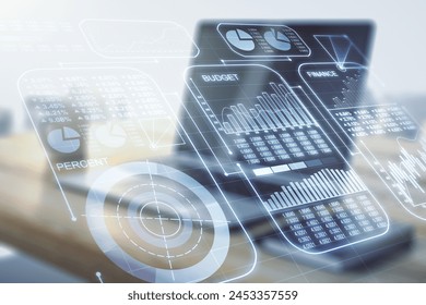 Double exposure of abstract creative statistics data hologram and modern desktop with laptop on background, statistics and analytics concept