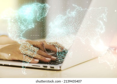 Double Exposure Of Abstract Digital World Map And Hand Typing On Laptop On Background, Big Data And Blockchain Concept