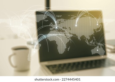 Double exposure of abstract digital world map with connections on laptop background, research and strategy concept