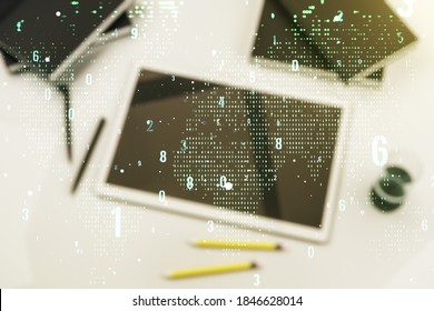 Double exposure of abstract programming language hologram with world map and digital tablet on background, top view, research and development concept