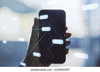 Double exposure of abstract programming language hologram and hand with cell phone on background, research and development concept