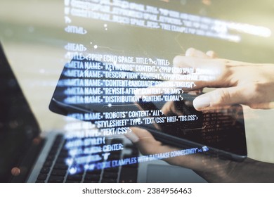 Double exposure of abstract programming language hologram with finger clicks on a digital tablet on background, research and development concept
