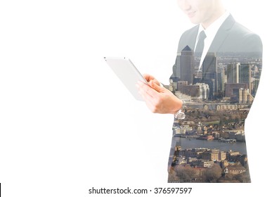 Double Exposure Of Asian Businessman Using The Tablet 