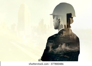 Double Exposure Of Asian Engineer And Cityscape Background