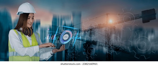 Double exposure of asian engineering  woman using laptop computer and digital technology interfaces icon on construction cranes background, Technology and business industrial concept.