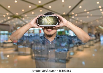 Double exposure of Asian man wearing virtual reality over the abstract photo blurred background of department store shop background, VR concept